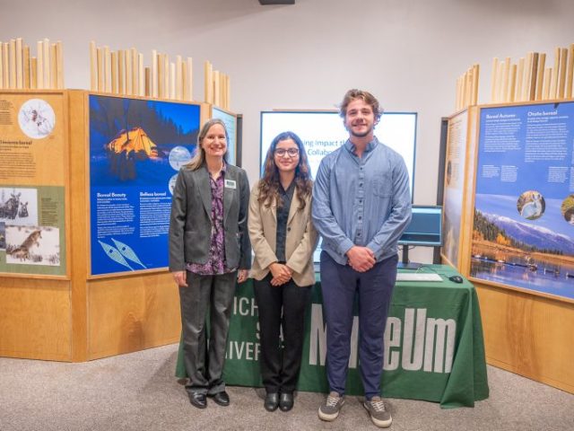 Two MSU students and one Museum staff person posing in the "Knowing Nature" exhibition
