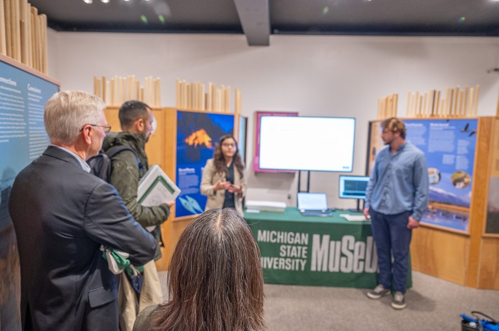 MSU students explain their work on RFID project to an audience in the "Knowing Nature" exhibition.