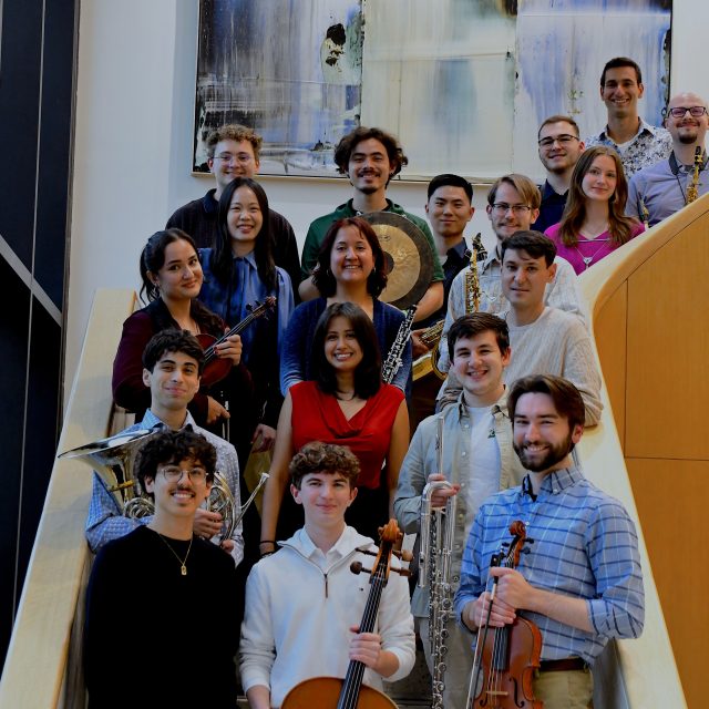 Block image A diverse group of MSU student musicians pose with their instruments on a curving stairwell.